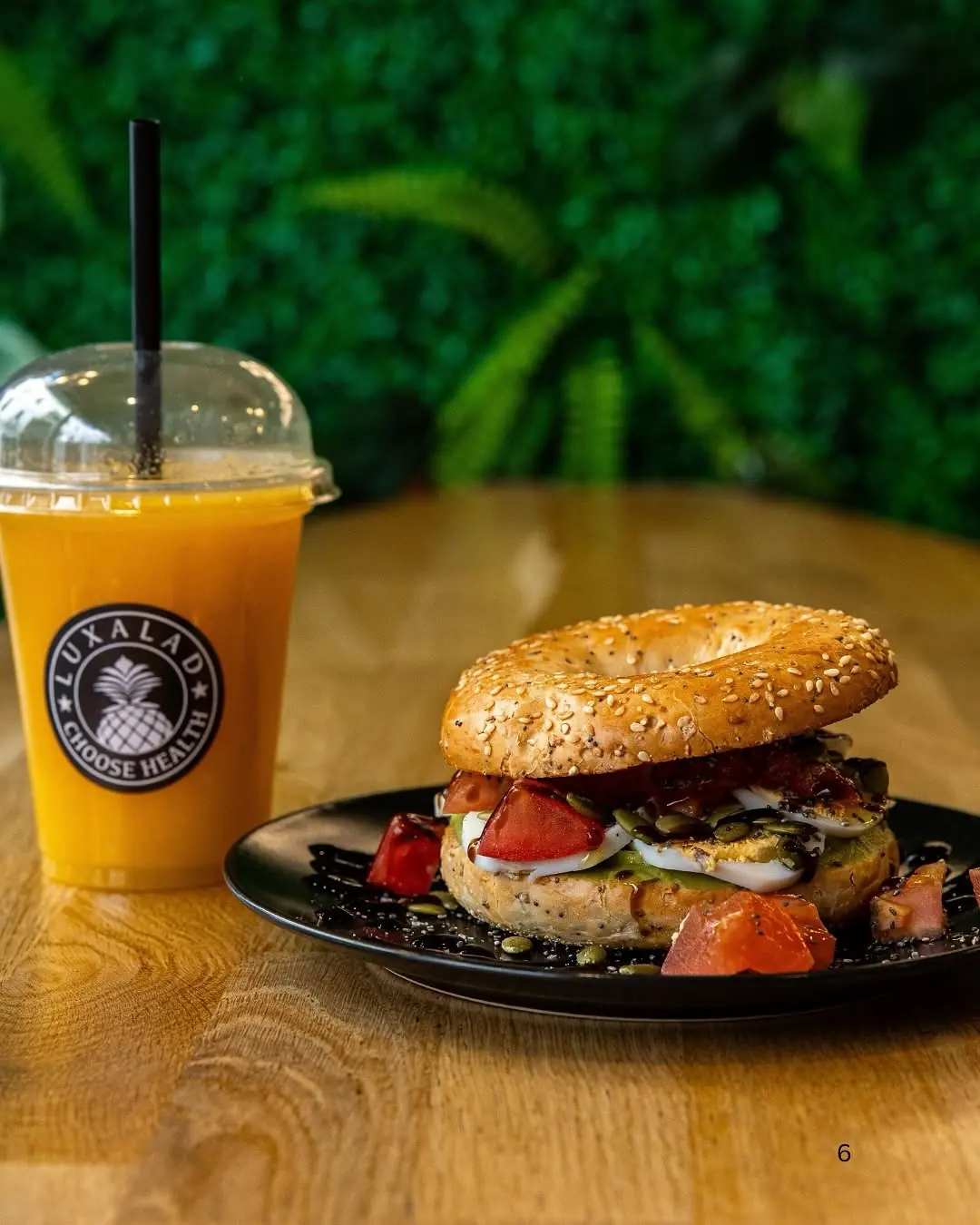 A Luxalad bagel with a fresh orange juice