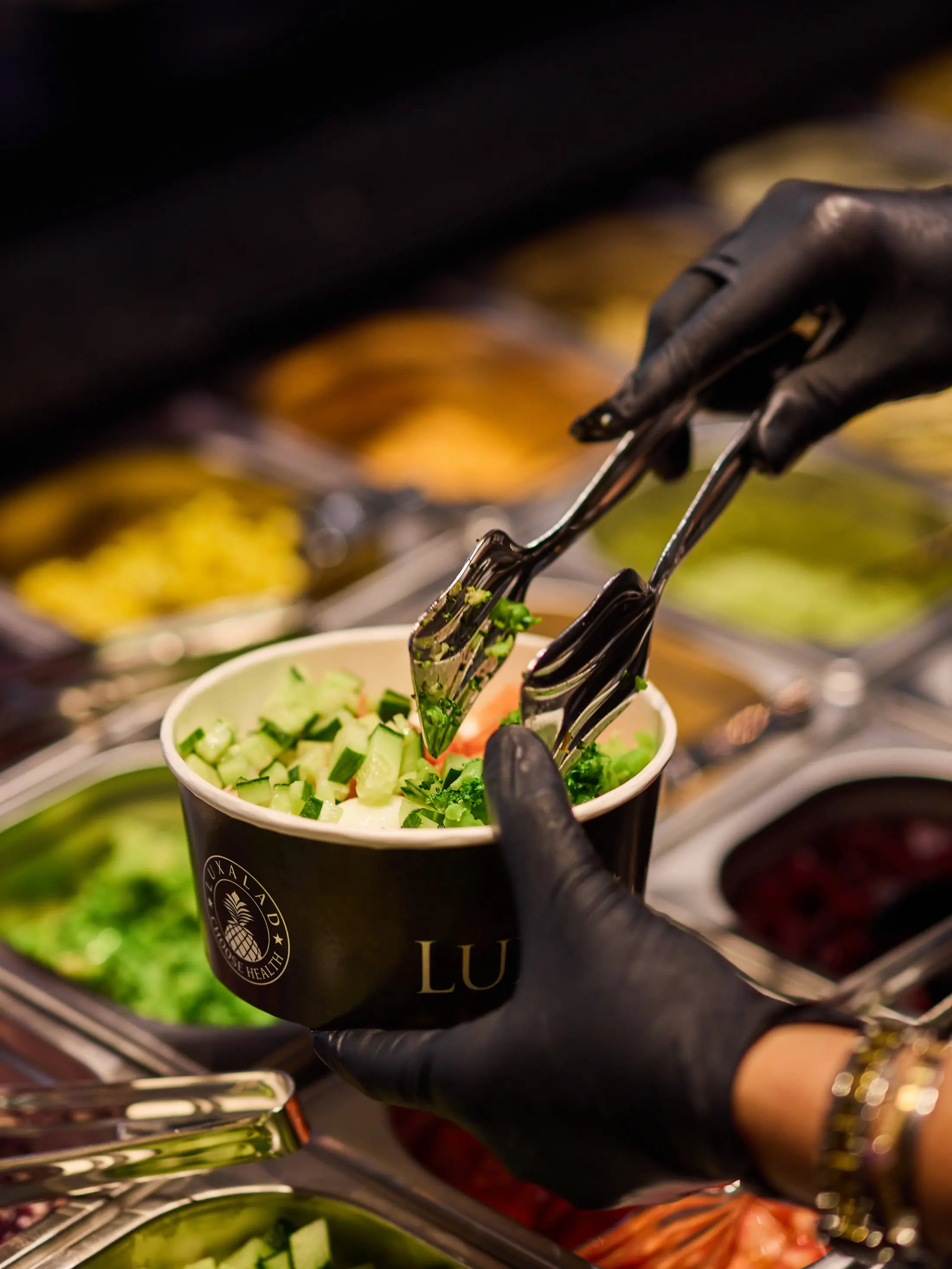 A Luxalad bowl being filled to order at the bar